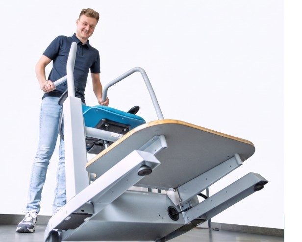 Moving the Orthostand between rooms on its wheels