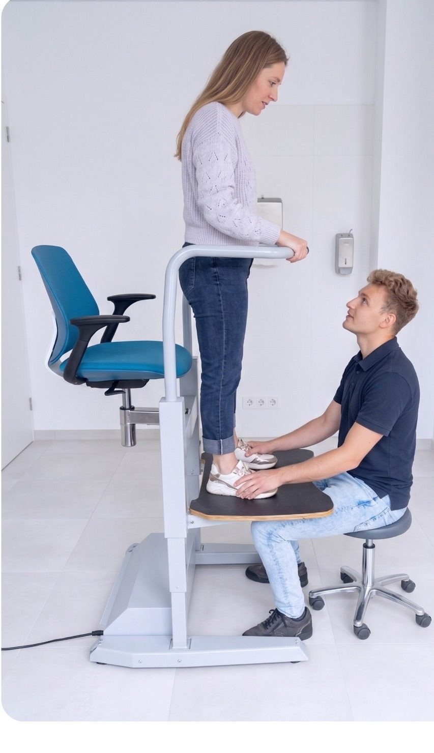 The Orthostand M30 demonstrated with a client standing on the platform
